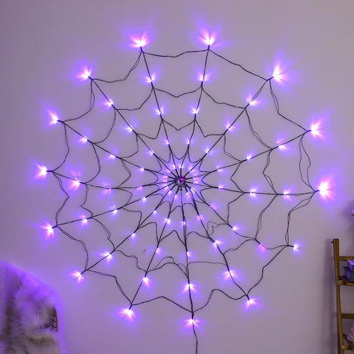 Glowing purple spider web light hanging on a wall
